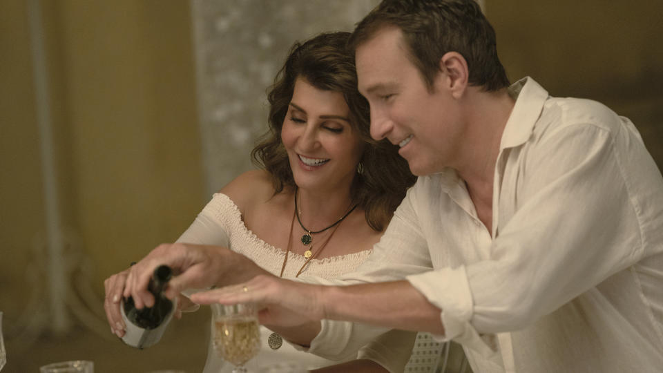 This image released by Focus Features shows Nia Vardalos, left, and John Corbett in a scene from "My Big Fat Greek Wedding 3." (Yannis Drakoulidis/Focus Features via AP)