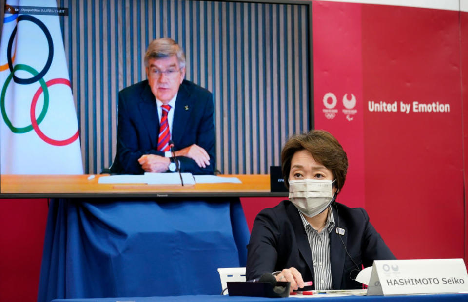 International Olympic Committee (IOC) president Thomas Bach (on a screen) delivers an opening speech while Tokyo 2020 Organizing Committee president Seiko Hashimoto listens on Wednesday. Source: Getty