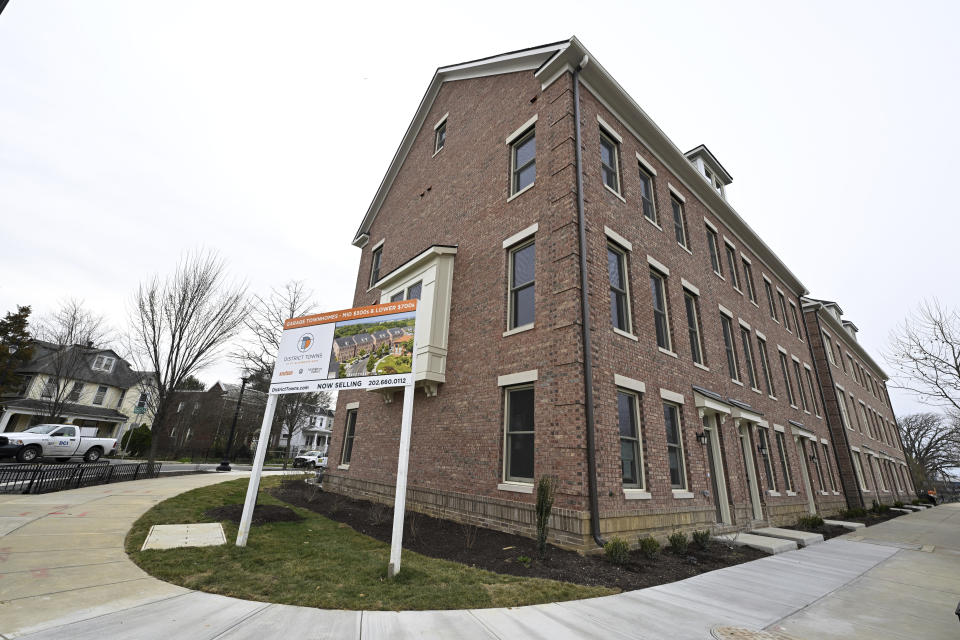 Newly constructed townhomes are seen on Malcolm X Alley and Sycamore drive near the Entertainment and Sports Arena, Friday, March 1, 2024, in Washington. The proposed move of the Capitals and Wizards sports teams to nearby Virginia has stoked concern in a pair of fragile Washington neighborhoods. (AP Photo/Terrance Williams)