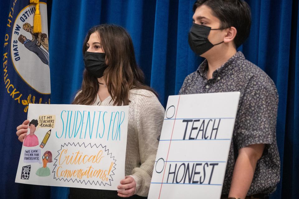 Students hold signs inside the Kentucky Capitol Rotunda in opposition to bills Kentucky lawmakers say would eradicate "critical race theory" from state schools. Jan. 12, 2022