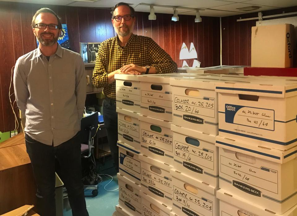 Josh Levy (left) and Mat Darby (right), both of the Library of Congress' manuscript division, stand next to dozens of boxes of papers and documents created by Gloria Gilmer, a Milwaukee mathematician, teacher, and leader in the field of ethnomathematics. Gilmer is the first Black woman mathematician to have her papers preserved in the library's manuscript division. Levy, a historian of science and technology, and Darby, an assistant head of the manuscript division’s preparation section, spent two days going through her records.