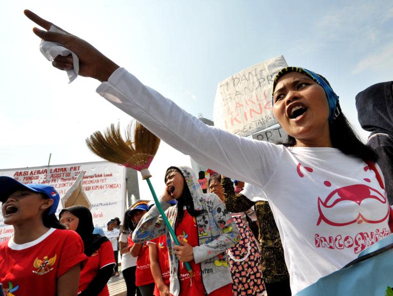 Women shout slogans during a rally in Jakarta on August 2, 2009 demanding the Indonesian government to protect overseas maids and migrant workers from abuse