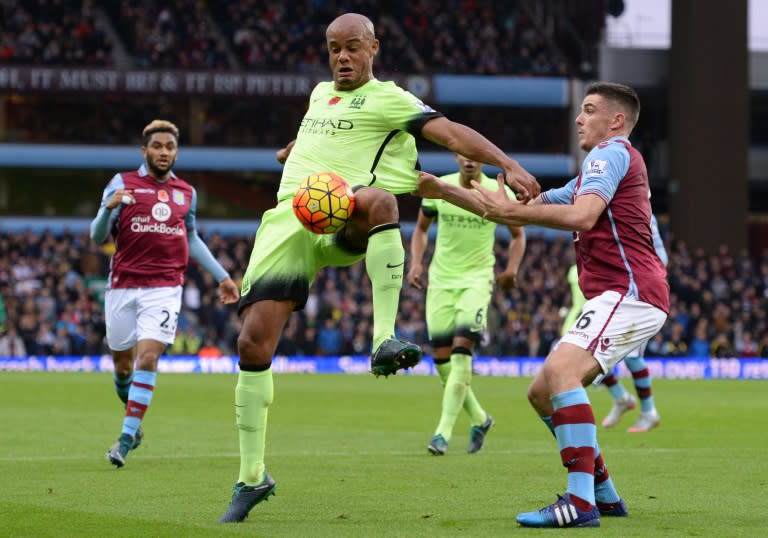 Captain and defensive leader Vincent Kompany (L) has been badly missed by Manchester City and faces another fortnight out with a calf problem