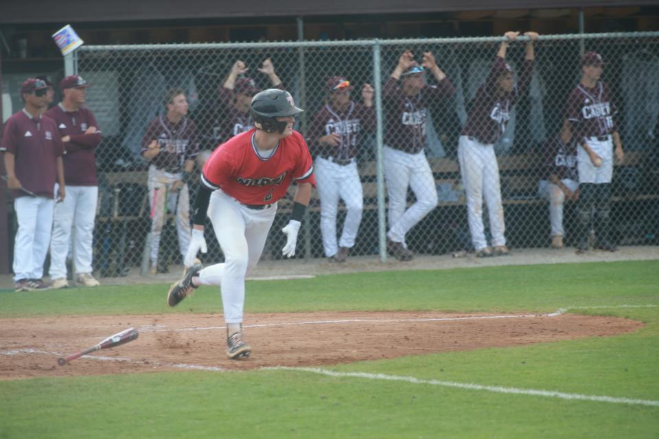 North Oconee's Grayson Godbee runs toward first base after a hit during Saturday's state semifinal playoff series at Benedictine.