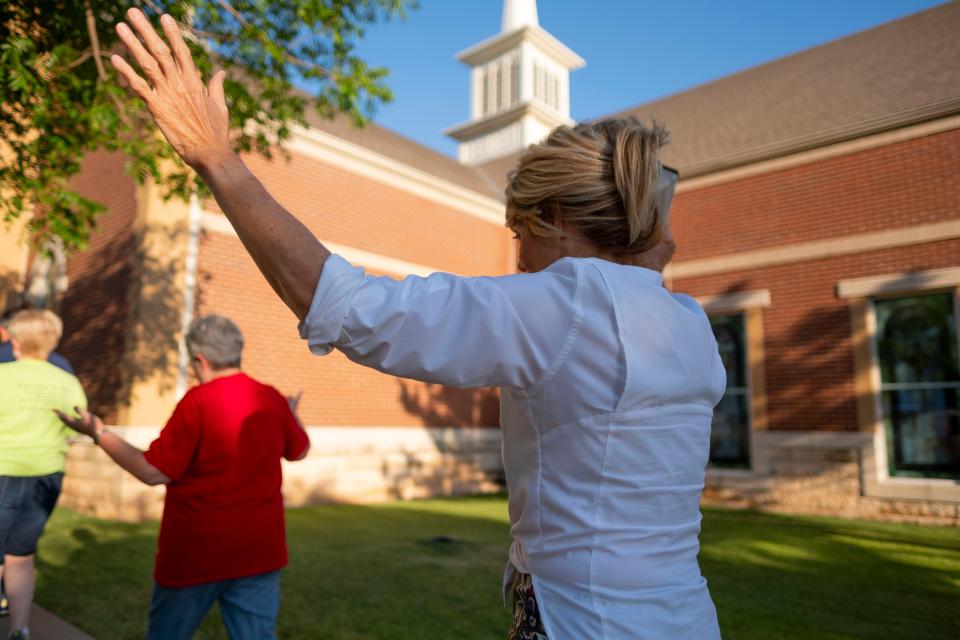 First United Methodist Church of Oklahoma City members and supporters pray Thursday as they march around the First Church building.