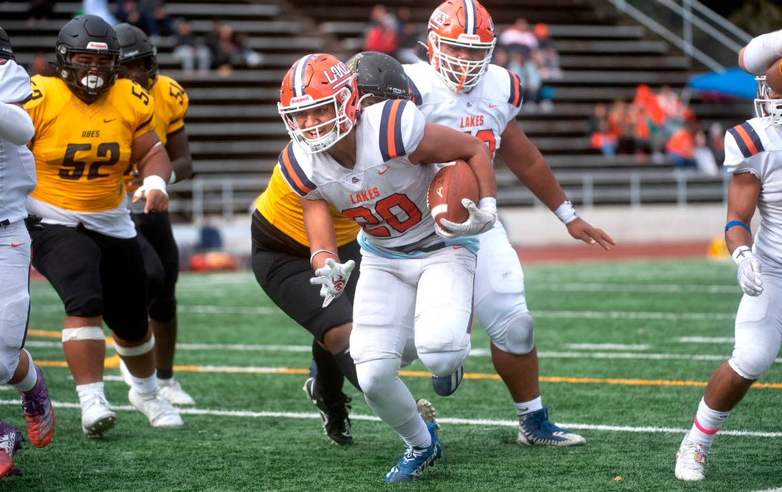 Lakes running back Leo Pulalasi breaks loose on the Lincoln defense during Saturday afternoon’s football game at Lincoln Bowl in Tacoma, Washington, on Oct. 22, 2022.