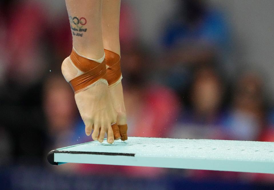 The Olympic tattoos of Yan Yee Ng (MAS)  in the women's 3m springboard diving competition during the Tokyo 2020 Olympic Summer Games at Tokyo Aquatics Centre on July 30, 2021. 