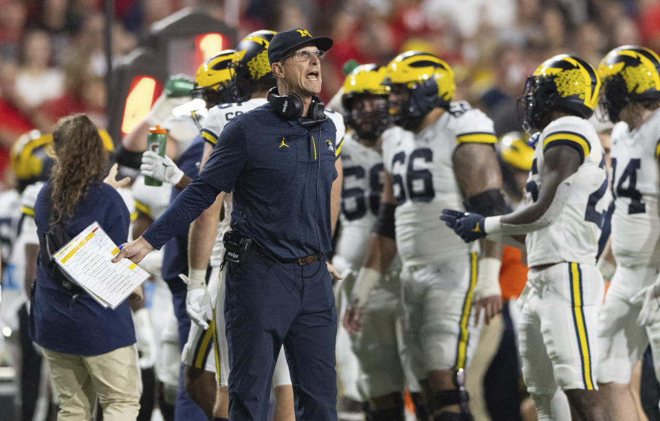 Michigan coach Jim Harbaugh yells to officials during a timeout in the first half of an NCAA college football game against Nebraska on Saturday, Oct. 9, 2021, in Lincoln, Neb. (AP Photo/Rebecca S. Gratz)