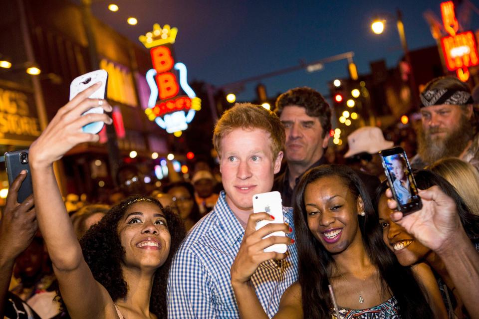 matthew hicks surrounded by people snapping photos on i wanna marry harry