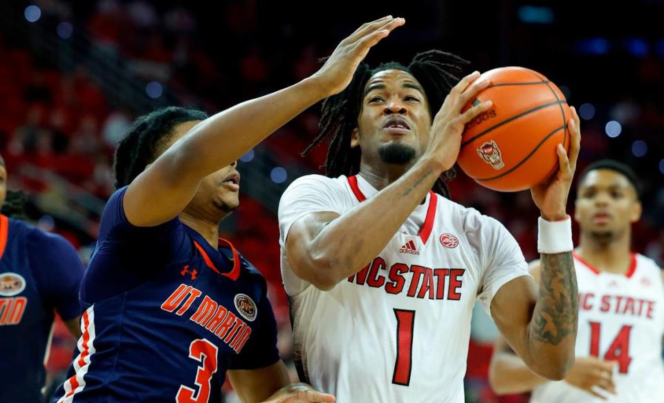 N.C. State’s Jayden Taylor (1) heads to the basket while defended by UT Martin’s Jordan Sears (3) during the first half of N.C. State’s game against UT Martin at PNC Arena in Raleigh, N.C., Tuesday, Dec. 12, 2023.