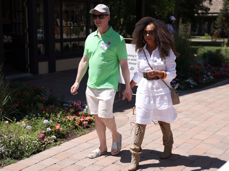 Ben Horowitz and Felicia Horowitz holding hands while walking at Sun Valley