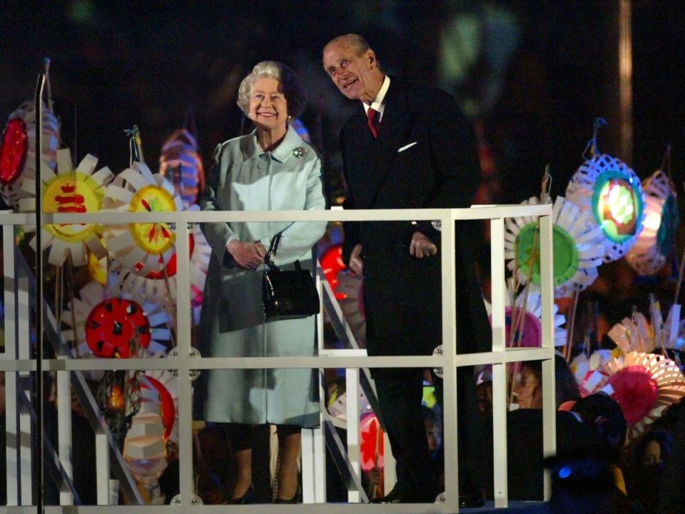 Queen Elizabeth II and her husband Prince Philip, the Duke of Edinburgh watch a fireworks display to celebrate her Golden Jubilee at Buckingham Palace (Getty Images)