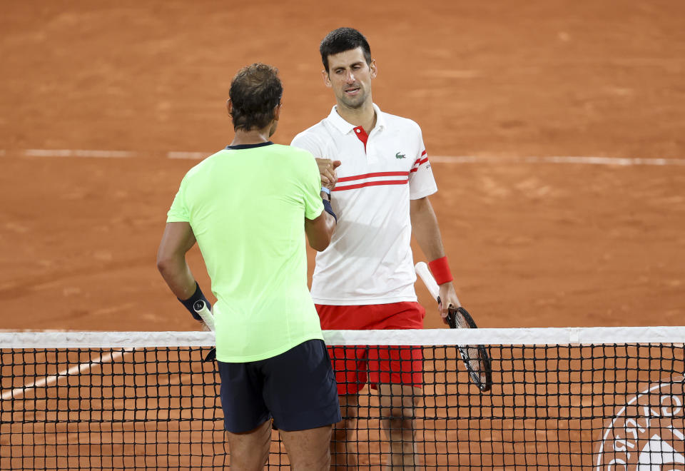 PARIS, FRANCE - JUNE 11: Novak Djokovic of Serbia salutes Rafael Nadal of Spain after his semi-final victory during day 13 of the French Open 2021, Roland-Garros 2021, Grand Slam tennis tournament at Roland Garros stadium on June 11, 2021 in Paris, France. (Photo by John Berry/Getty Images)