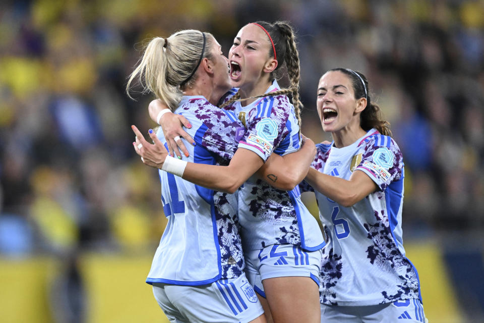 Spain's Athenea del Castillo, center, celebrates scoring with team mates Alexia Putellas, left, and Aitana Bonmati during the UEFA Women's Nations League soccer match between Sweden and Spain at Gamla Ullevi stadium in Gothenburg, Sweden, Friday, Sept. 22, 2023. (Björn Larsson Rosvall/TT News Agency via AP)