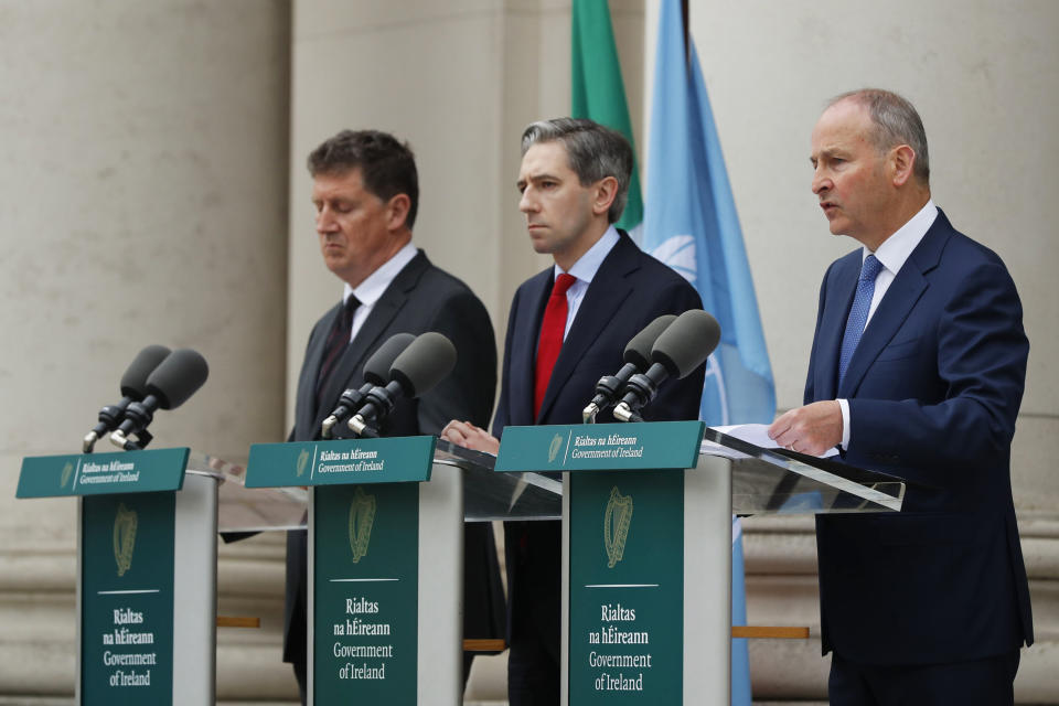 The three Irish Government leaders from left, Minister Eamon Ryan, Taoiseach Simon Harris and Tanaiste Micheal Martin speak to the media during a press conference outside the Government Buildings, in Dublin, Ireland, Wednesday, May 22, 2024. European Union countries Spain and Ireland as well as Norway on Wednesday announced dates for recognizing Palestine as a state.(Damien Storan/PA via AP)