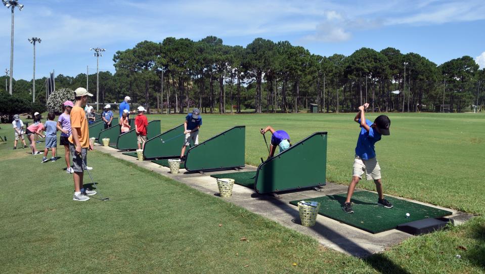 Young people practiced their swings at the Golf Garden on U.S. Highway 98 in Miramar Beach. Walton County purchased part of the Golf Garden acreage two years ago, and will soon host public workshops to get input on what to do with the acreage.