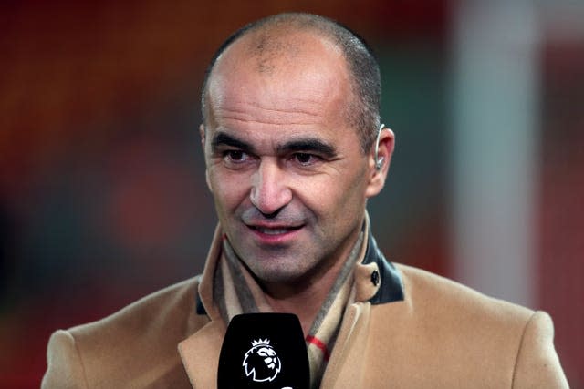 Roberto Martinez speaks into a microphone