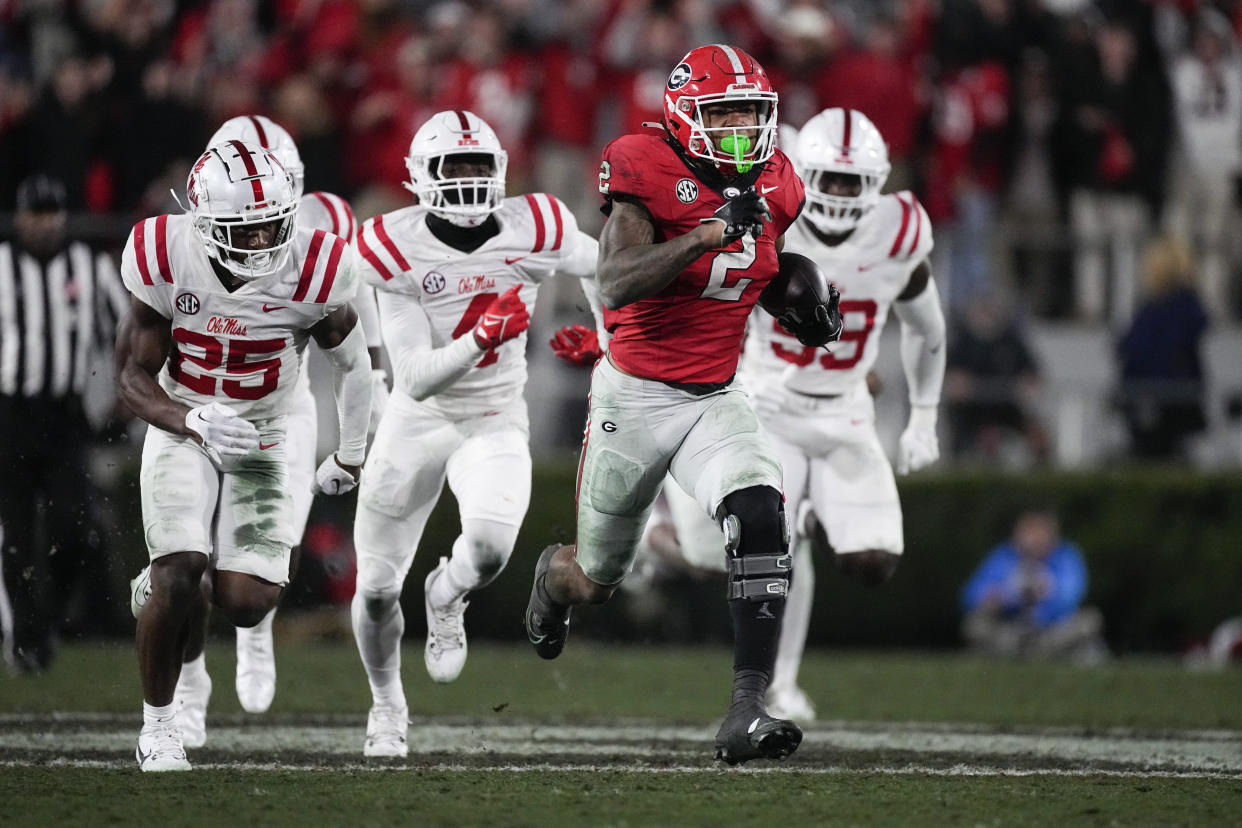 Kendall Milton (2) and the Georgia Bulldogs ran way from Mississippi on Saturday in Athens, Ga. Georgia was one of five undefeated CFP contenders to win Saturday. (AP Photo/John Bazemore)