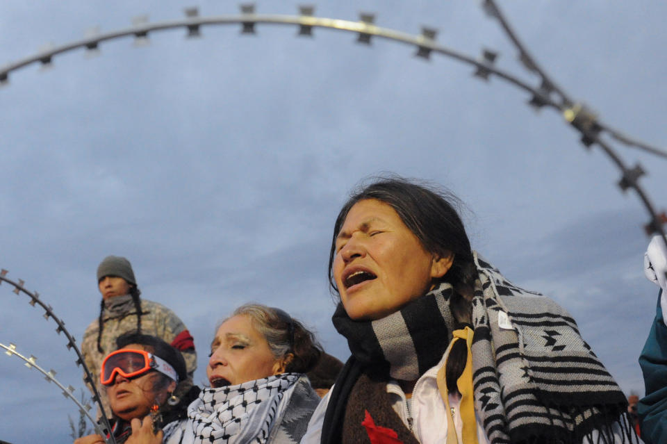 Women hold a prayer ceremony.