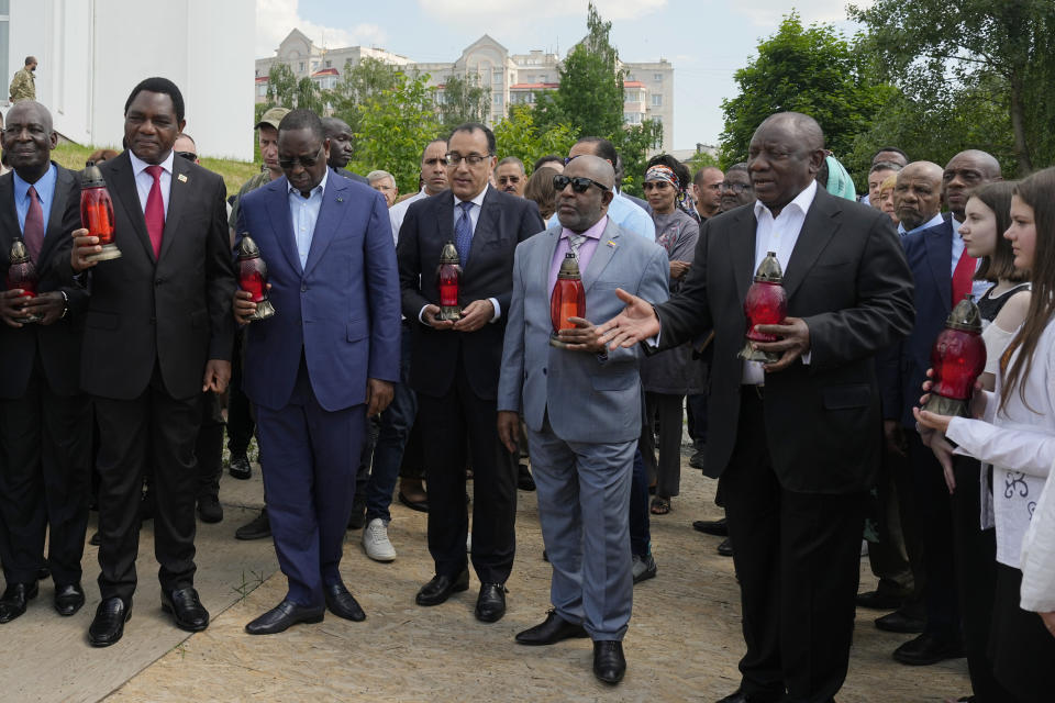 South African President Cyril Ramaphosa, Egypt's Prime Minister Mustafa Madbuly, President of the Union of Comoros Azali Assoumani, Senegal's President Macky Sall and Zambia's President Hakainde Hichilema attend a commemoration ceremony at a site of a mass grave in Bucha, on the outskirts of Kyiv, Ukraine, Friday, June 16, 2023. South African President Cyril Ramaphosa arrived in Ukraine on Friday as part of a delegation of African leaders and senior officials seeking ways to end Kyiv's 15-month war with Russia. (AP Photo/Efrem Lukatsky)