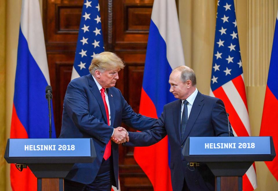 <p>U.S. President Donald Trump and Russia’s President Vladimir Putin shake hands before attending a joint press conference after a meeting at the Presidential Palace in Helsinki, on July 16, 2018. (Photo: Yuri Kadobnov/AFP/Getty Images) </p>