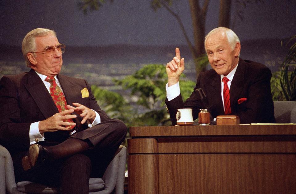 In this May 22, 1992 file photo, Ed McMahon, left, and host Johnny Carson are shown on "The Tonight Show" for their final broadcast in Burbank, Calif. With his debut as host of NBC's "The Tonight Show" 50 years ago this October, until he retired from the show on May 22, 1992, he was seen by more people on more occasions than anyone else in American history. "Johnny Carson: King of Late Night," a two-hour "American Masters" portrait premiers Monday at 9 p.m. EDT on PBS. (AP Photo/Douglas Pizac, file)