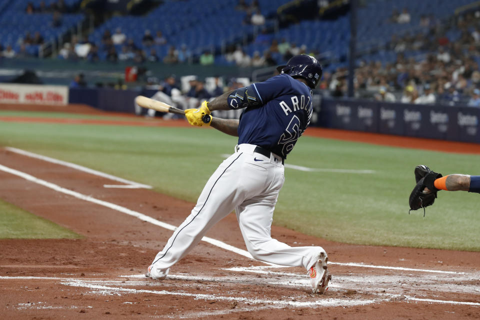 Tampa Bay Rays' Randy Arozarena hits an RBI-triple against the Houston Astros during the first inning of a baseball game Monday, April 24, 2023, in St. Petersburg, Fla. (AP Photo/Scott Audette)