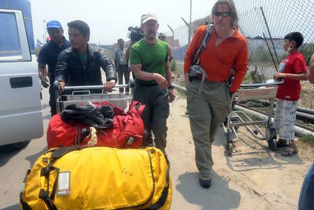 U.S. climbers arrive from Lukla after the Everest route was closed to summiteers, at the domestic airport in Kathmandu, April 26, 2014. REUTERS/Bikash Dware