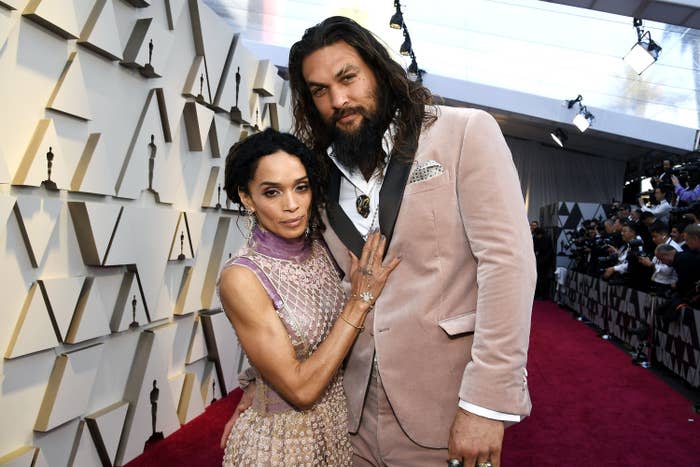 Jason and Lisa posing on the Oscars red carpet