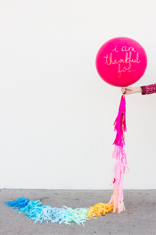 <p>Studio DIY</p><p>This turkey DIY is pretty simple! Just have each kid pick out a balloon and then write “I am thankful for…” or another Thanksgiving phrase on it with gold paint. Then, tie some colorful ribbons to it, like <a href="https://studiodiy.com/diy-i-am-thankful-for-balloon/" rel="nofollow noopener" target="_blank" data-ylk="slk:Studio DIY;elm:context_link;itc:0;sec:content-canvas" class="link "><em>Studio DIY</em></a> did, and wrap it around a chair at your table.</p>