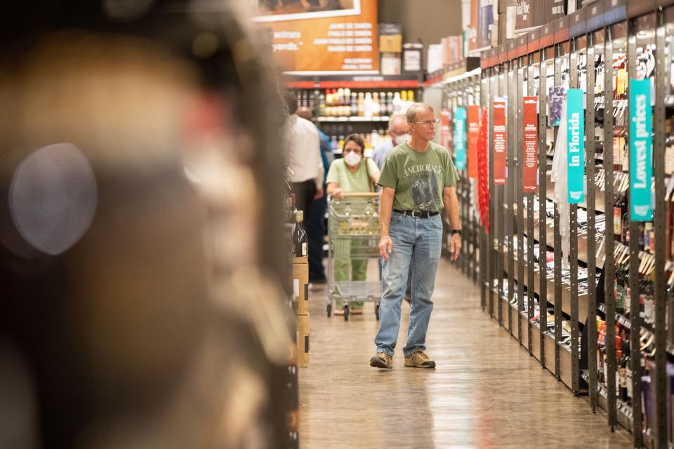 Shoppers explore the aisles of Total Wine during the business’ Oct. 6, 2022, grand opening of the Tallahassee location.