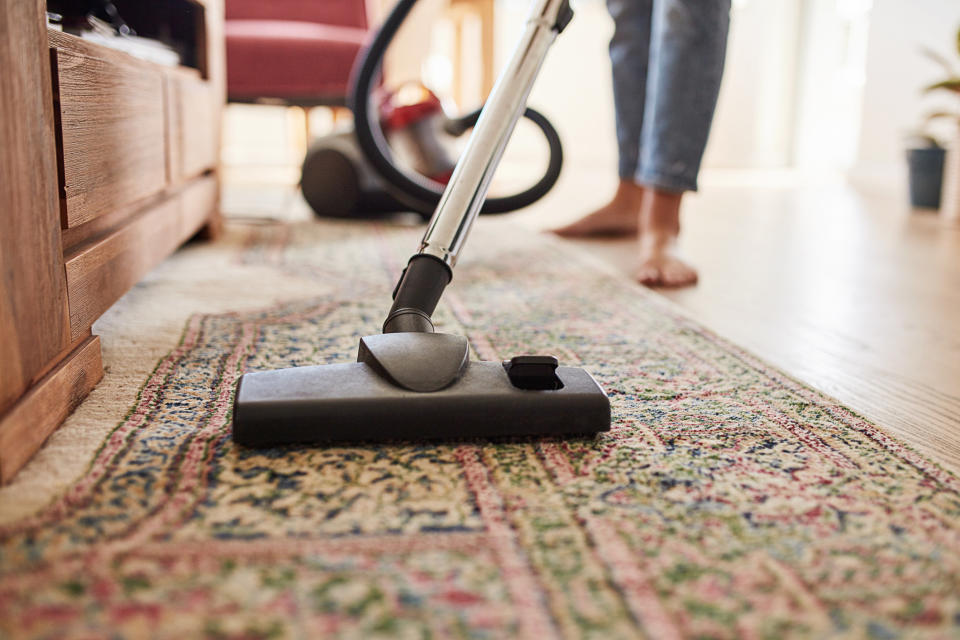 Cleaning a rug.