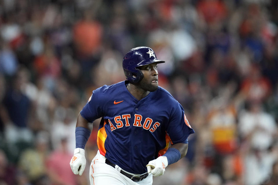 Houston Astros' Yordan Alvarez watches his RBI-double against the Texas Rangers during the fifth inning of a baseball game Sunday, May 22, 2022, in Houston. (AP Photo/David J. Phillip)