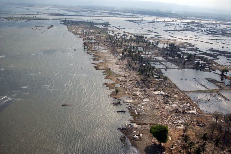 An aerial photograph taken February 12, 2005, shows damage six weeks after a tsunami hit Banda Aceh on the island of Sumatra, Indonesia. On March 28, 2005, an 8.6-magnitude earthquake jolted the western coast of Sumatra, killing at least 1,300 people and destroying hundreds of buildings. File Photo courtesy of Jon Gesch/Navy