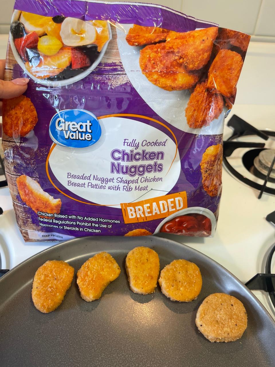 uncooked great value  chicken nuggets with bag in background