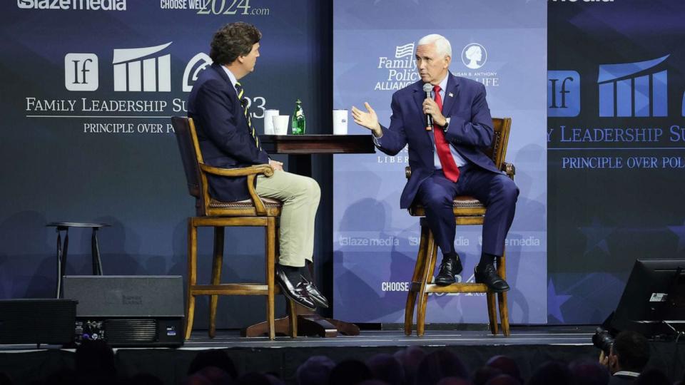 PHOTO: Republican presidential candidate, former Vice President Mike Pence fields questions from former Fox News Television personality Tucker Carlson at the Family Leadership Summit, July 14, 2023, in Des Moines, Iowa. (Scott Olson/Getty Images)