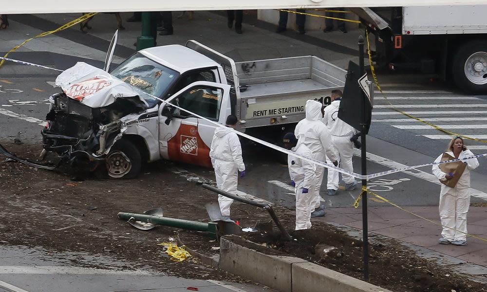 Authorities stand near a damaged Home Depot truck after a motorist drove onto a bike path near the World Trade Center memorial in New York. 