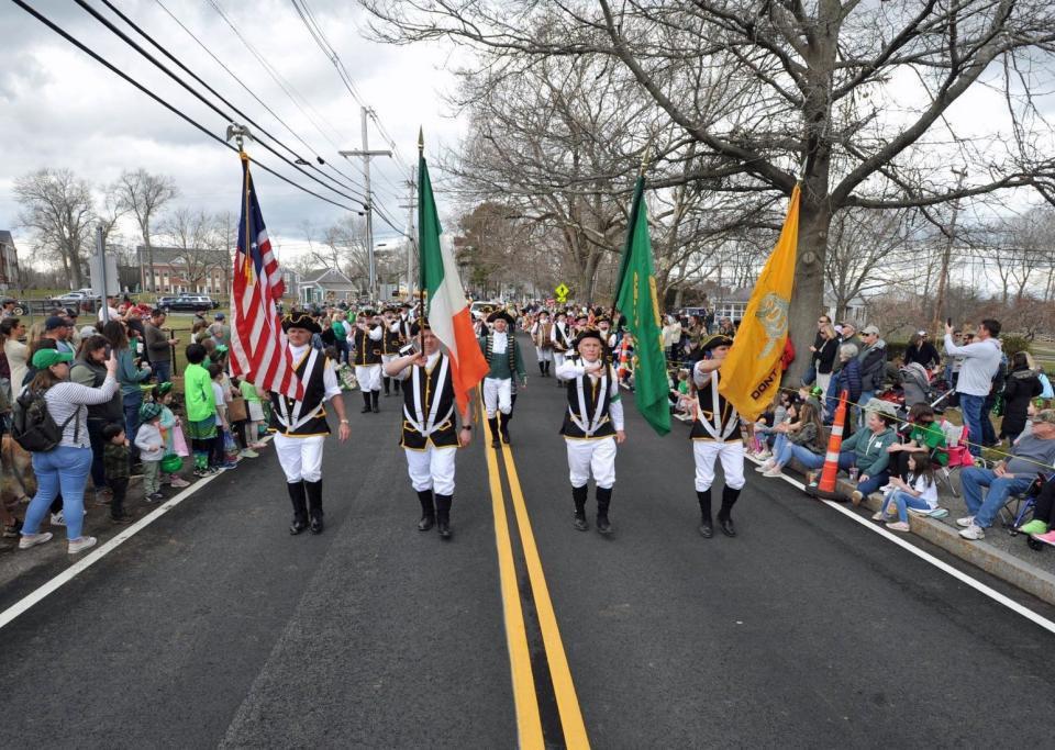 The Colonial Boys color guard leads the Scituate St. Patrick's Parade, Sunday, March 20, 2022.