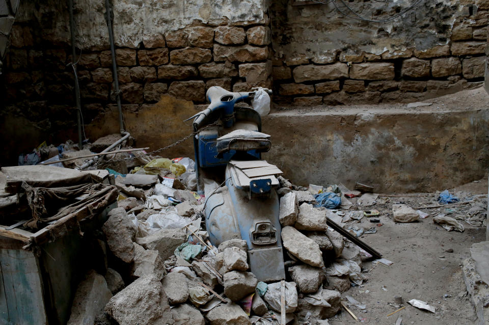 <p>An old Vespa scooter is chained at the premises of a house in low-income neighbourhood in Karachi, Pakistan, Feb. 26, 2018. (Photo: Akhtar Soomro/Reuters) </p>