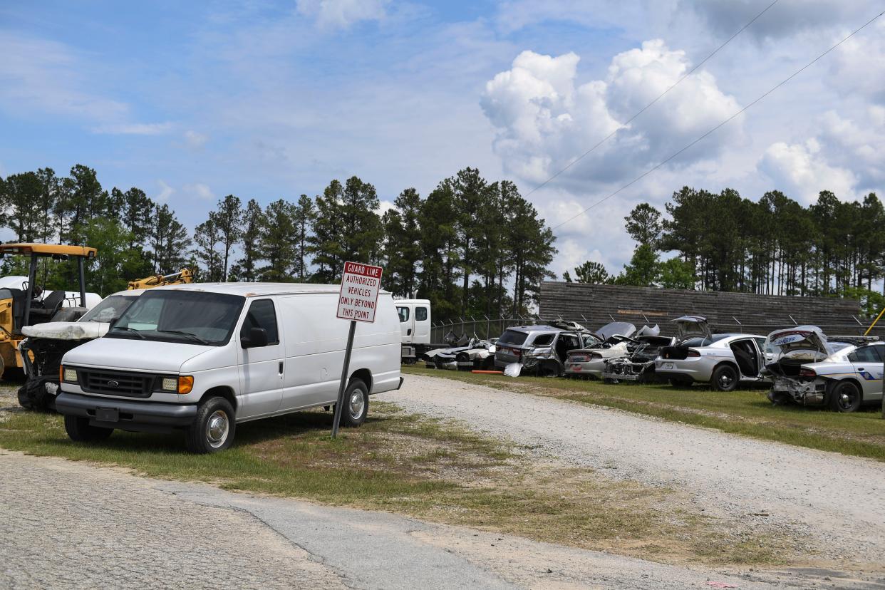 An old coroner's van sits in a lot behind the Columbia County Fleet Services building on Friday, May 3, 2024. These vehicles and more will be auctioned off by the county on May 18th.