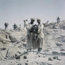 FILE - In this April 1964 file photo, Workers are shown during construction of the Aswan High Dam over the river Nile in Egypt. Egyptians are marking 50 years since the inauguration of the Nile dam, a massive feat of construction that has shaped the course of modern-day Egypt. It spared it from seasonal droughts and flooding, and generated electricity. (AP Photo, File)