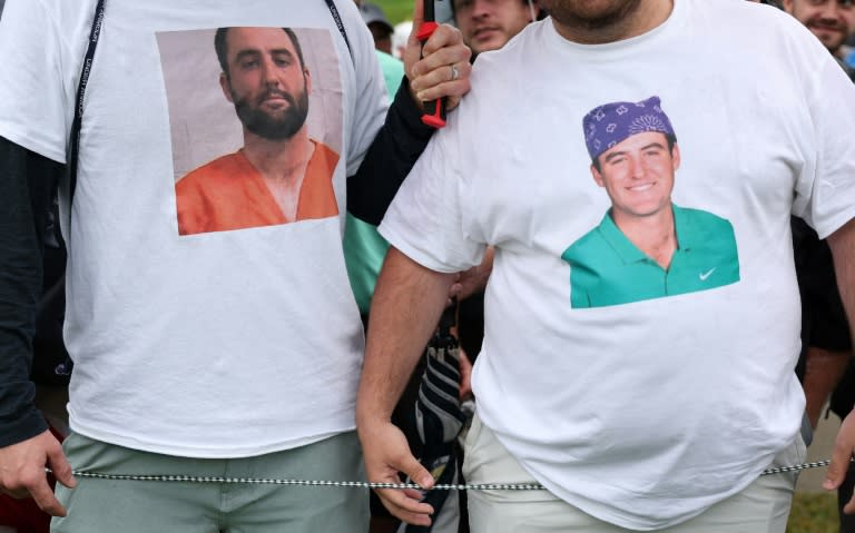 Fans wore T-shirts of top-ranked Scottie Scheffler at round two of the PGA Championship, one at left with the mug shot photo taken only hours earlier of the two-time Masters champion (Patrick Smith)