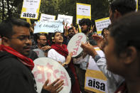 Indian students beat drums as they shout slogans during a protest march towards the Parliament in New Delhi, India, Saturday, Nov. 23, 2019. Hundreds of students of the Jawaharlal Nehru University were joined by students from other universities, activists and members of civil society as they marched towards India's parliament to protest against the hostel fee hike, along with their other demands. (AP Photo/Altaf Qadri)