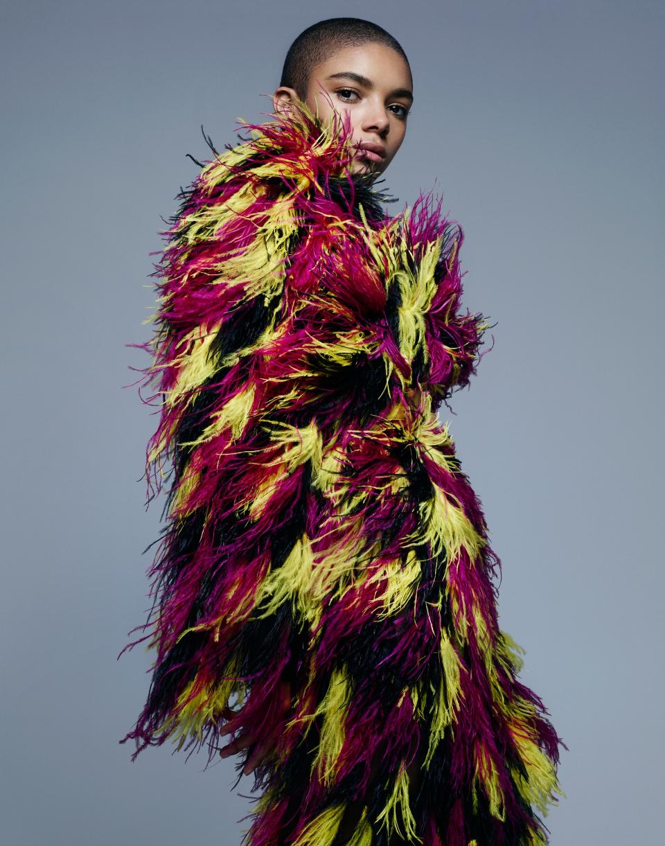 model wearing multi-colored coat