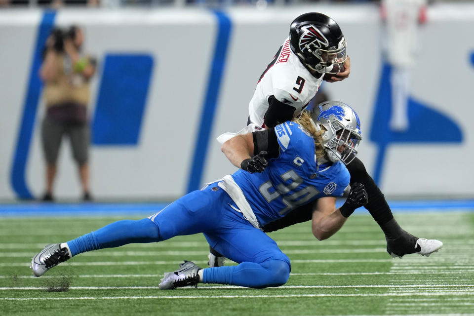 Atlanta Falcons quarterback Desmond Ridder (9) is brought down by Detroit Lions linebacker Alex Anzalone (34) in the first half of an NFL football game Sunday, Sept. 24, 2023, in Detroit. (AP Photo/Paul Sancya)