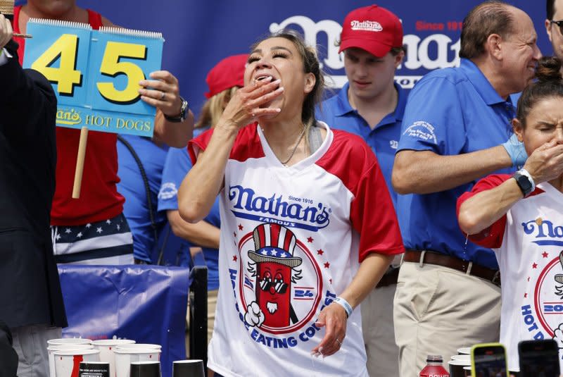 Miki Sudo competes in the women's 108th Nathan's Hot Dog Eating Contest in Coney Island, Brooklyn, N.Y., on Thursday. Sudo swallowed 51 hot dogs, breaking her record for women. Photo by Peter Foley/UPI