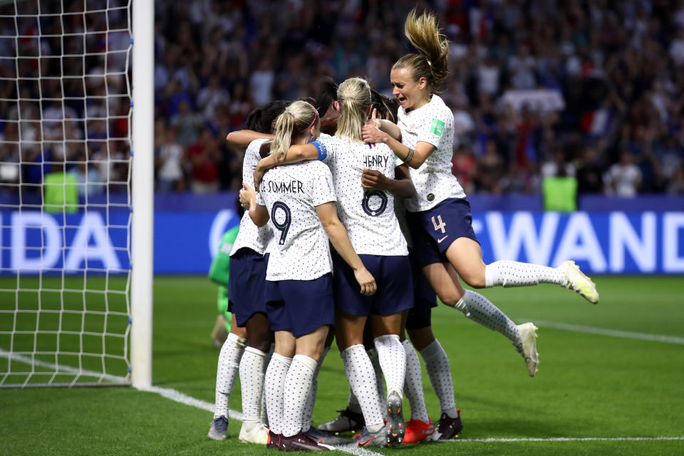 Valerie Gauvin of France celebrates her team's first goal with team mates during the 2019 FIFA Women's World Cup France Round Of 16 match between France and Brazil at Stade Oceane on June 23, 2019 in Le Havre, France. (Photo by Alex Grimm/Getty Images)