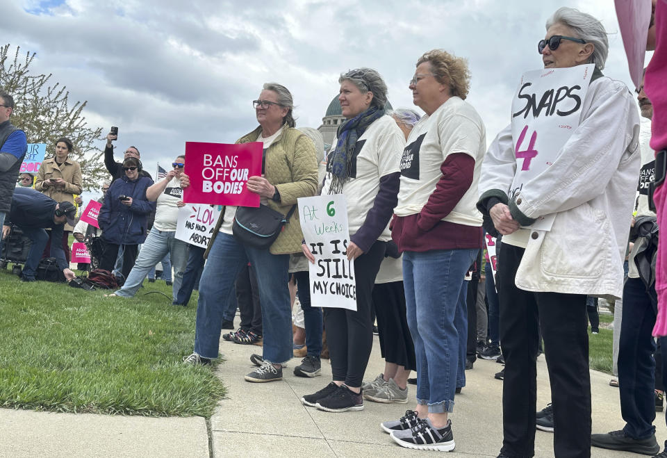 Iowans supporting access to abortion rally on Thursday, April 11, 2024, outside the courthouse in Des Moines, Iowa, where the Iowa Supreme Court heard arguments on the state's restrictive abortion law. The law that bans most abortions after about six weeks of pregnancy is on hold as the courts assess its constitutionality. (AP Photo/Hannah Fingerhut)