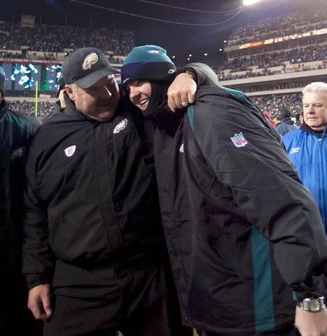 <p>Al Tielemans /Sports Illustrated via Getty</p> Andy Reid victorious with son Garrett Reid after the Philadelphia Eagles won the Super Bowl against the Green Bay Packers.