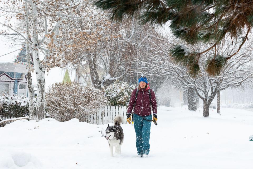 Hannah Trimble walks her dog Hatcher in Salt Lake City on Thursday, Jan. 11, 2024. Overnight snow blanketed the Wasatch Front. | Megan Nielsen, Deseret News